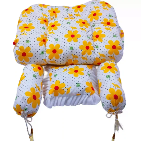 Side view of yellow baby bedding set with floral design and net